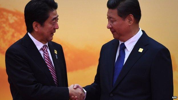 Papers see the meeting between President Xi Jinping (R) and PM Shinzo Abe a step in the right direction