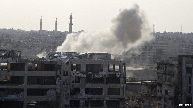 Smoke rises from al-Khalidiya neighbourhood of Aleppo in what activists said was shelling by Free Syrian Army fighters (10 November 2014)