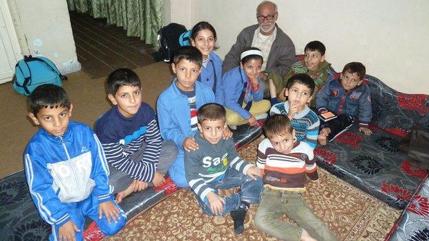 Abu Ismail Al-Hassan and some of his grandchildren