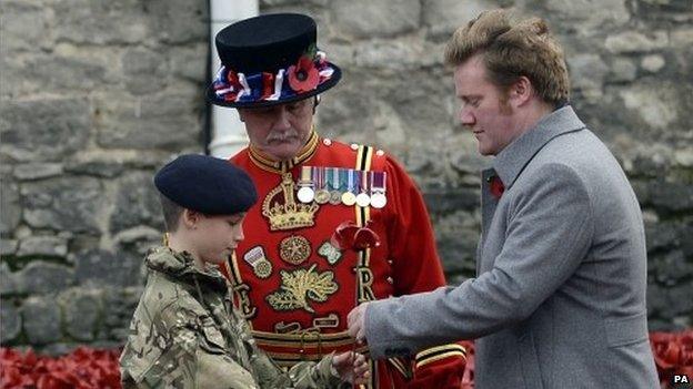 Cadet Harry Hayes (l) with artist Paul Cummins (r)