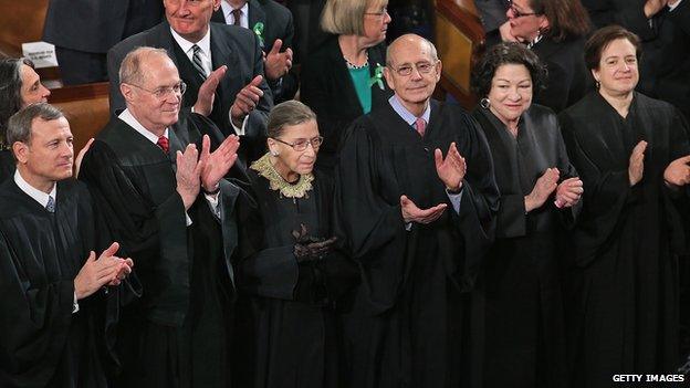 The Supreme Court justices applaud at the 2013 State of the Union address.