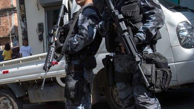 Police patrolling a Rio de Janeiro slum