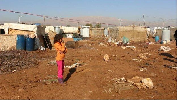 The refugee camp with a view of the mountains in the backgorund