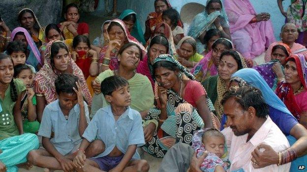 Relatives mourn the death of women who died after undergoing sterilization surgeries, at a village near Bilaspur, in the central Indian state of Chhattisgarh, Tuesday, Nov. 11, 2014