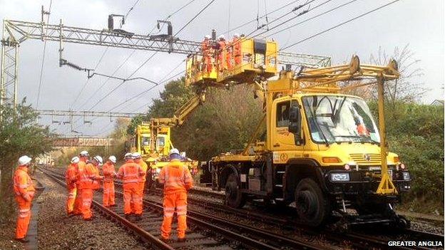 Rail engineers repairing Kelvedon overhead wire damage