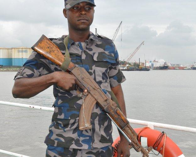 An armed officer on board a Nimasa boat, Nigeria