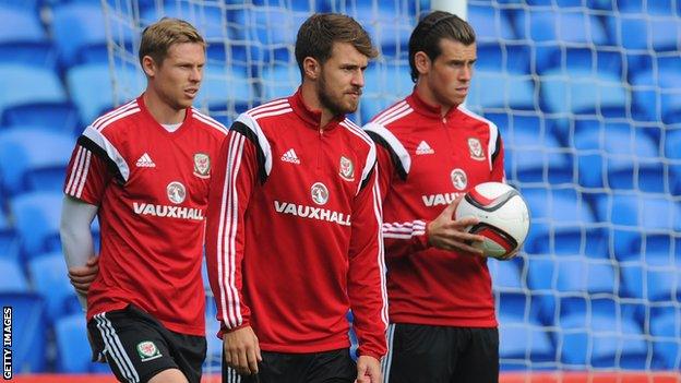 Aaron Ramsey (centre), flanked by Simon Church and Gareth Bale during Wales training, has suffered from injury this season