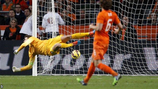 Netherlands goalkeeper Tim Krul is beaten by Carlos Vela's curling shot