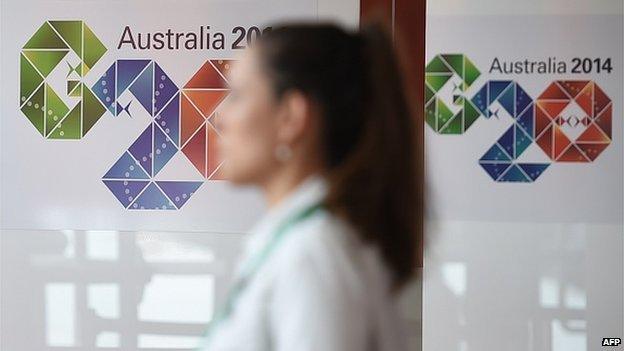 A visitor walks through the media centre ahead of the G20 Summit in Brisbane on November 13, 2014. Brisbane will host the G20 Leadership Summit on November 15-16