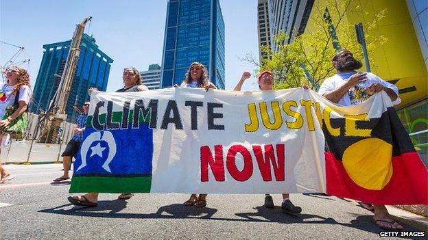 Demonstrators protest in the Brisbane CBD over climate change, uranium mining, coal seam gas fracking and traditional land rights ahead of the 2014 G20 Leaders Summit