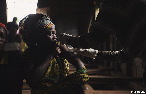 A woman is vaccinated