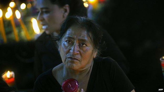 A woman prays at a temple outside Guatemala City