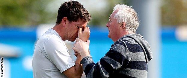 Darrell Clarke comforted by Bristol Rovers fan after relegation