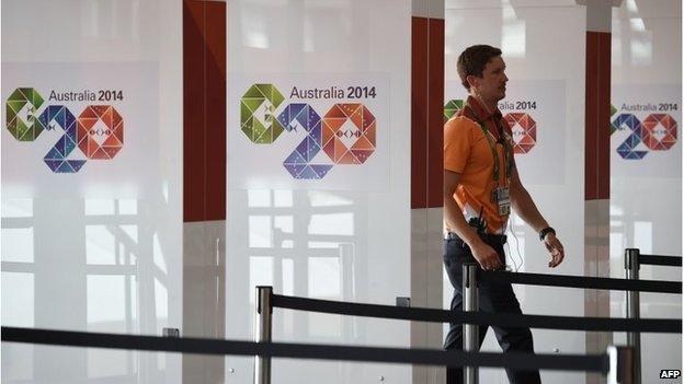 A visitor enters the media centre ahead of the G20 Summit in Brisbane on November 13, 2014.