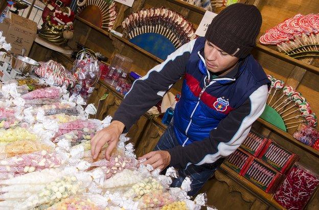 Cristian Lus arranging sweets