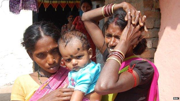 Nandini (left) holding Rekha's baby, and Anjani (right)