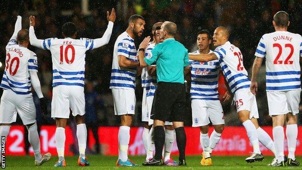 QPR players protest at Mike Dean's decision