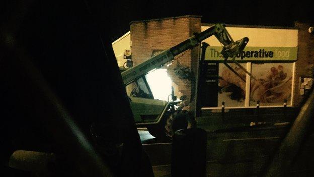 A picture of the digger outside the Co-operative store in Sapcote