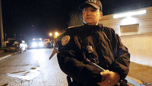 Policeman stands guard in Montevrain. 13 Nov 2014