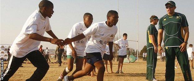 Springboks wing Bryan Habana (right) takes a coaching clinic in Soweto in 2008