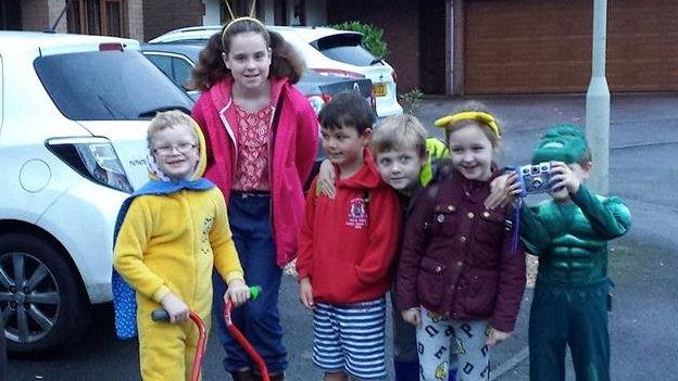 Taliesin and his friends pose for pictures before starting the 1km walk to school