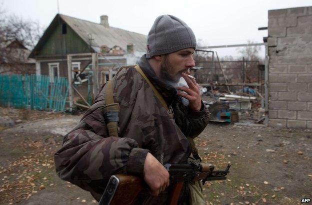 A pro-Russian rebel gunman on patrol in Donetsk, 13 November