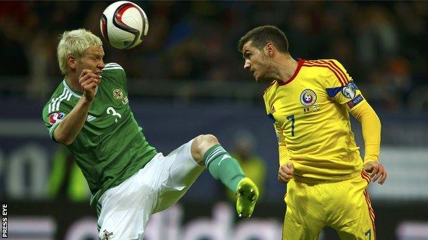 Ryan McGivern and Alexandru Chipciu in action as Northern Ireland go down in Bucharest