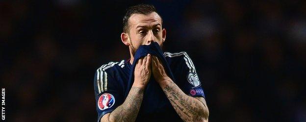 Steven Fletcher looks frustrated after missing a chance for Scotland