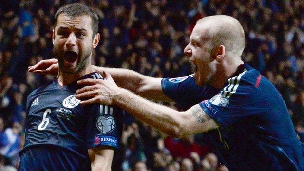 Shaun Maloney and Steven Naismith celebrate Scotland's 75th-minute winner