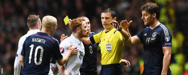 Ireland's Stephen Quinn and Scotland's Chris Martin argue at Celtic Park