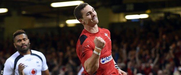 Wales" George North celebrates scoring the opening try during the Dove Men Series match at the Millennium Stadium, Cardiff.