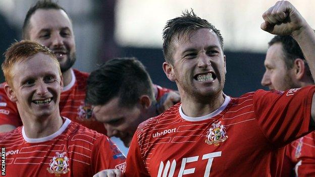 Mark McAllister celebrates after scoring Portadown's third goal against Glenavon