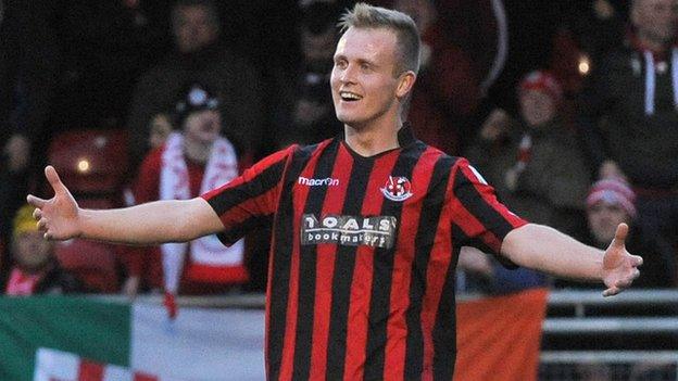 Jordan Owens celebrates scoring against Cliftonville