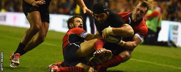 Victor Vito scores a try for New Zealand against Scotland