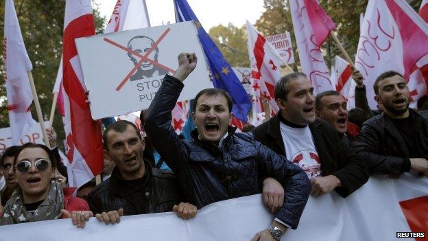 People shout slogans during an opposition in Tbilisi, Georgia on 15 November 2014