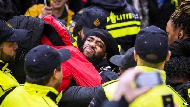 Members of the police and demonstrators clash during anti-Black Pete demonstration, Gouda, The Netherlands, 15 November 2014