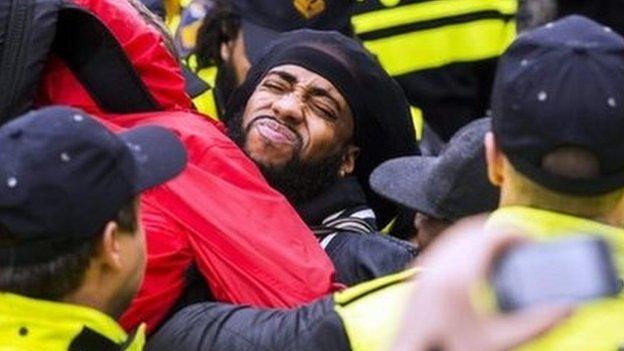 Members of the police and demonstrators clash during anti-Black Pete demonstration, Gouda, The Netherlands, 15 November 2014