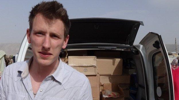 Handout picture of Peter Kassig in front of a truck somewhere along the Syrian border between late 2012 and autumn 2013