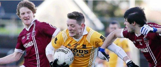 Slaughtneil pair Ronan Bradley and Karl McKaigue challenge Clontibret forward Conor McManus