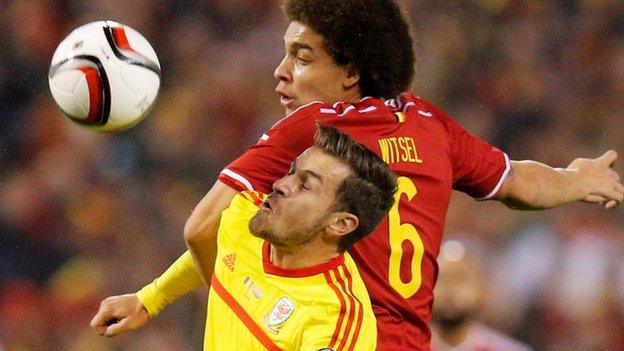 Axel Witsel climbs above Aaron Ramsey