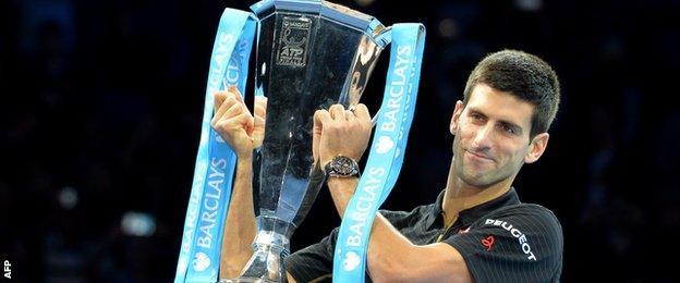 Novak Djokovic collects the ATP World Tour Final trophy