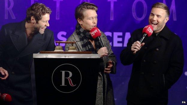 Gary Barlow (right), Howard Donald (left) and Mark Owen as the Regent Street Christmas lights were switched on