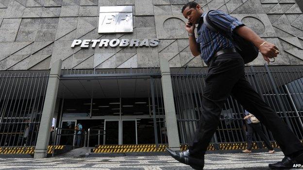 A man walks past the Petrobras building in Rio de Janeiro, Brazil, January 4, 2011.