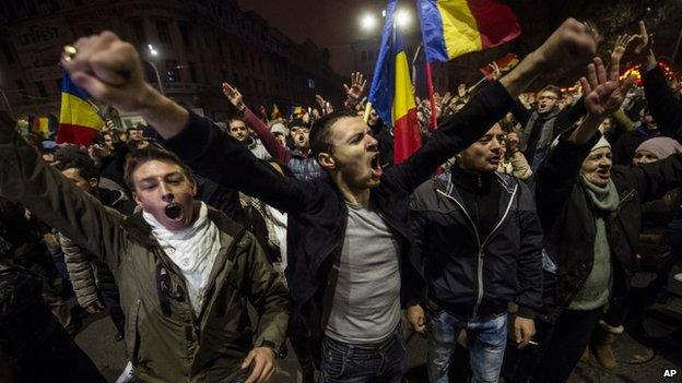 Anti-government supporters celebrate on Sunday night (16 Nov)