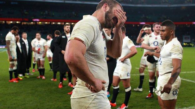 England's dejected players after the defeat by South Africa