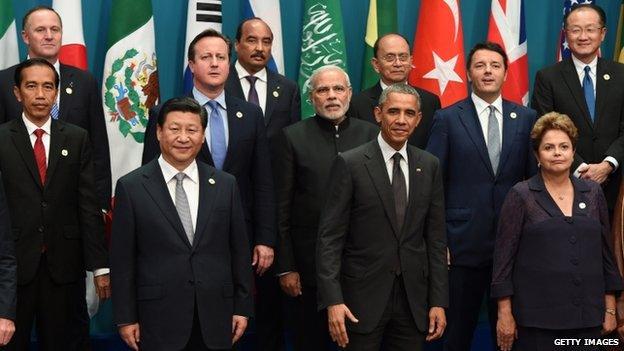 China's President Xi Jinping (front L) stands next to US President Barack Obama (front C) as they pose for the "family photo" of world leaders during the G20 Summit in Brisbane