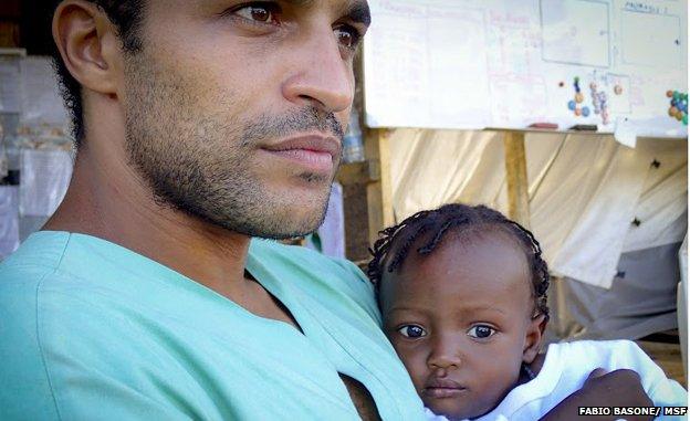 Dr Abdelmoneim with one of the children in his care