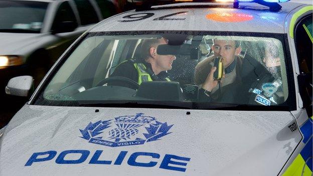 Police breathalyse drink-driver.