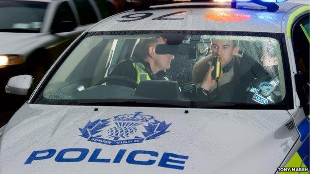 Police breathalyse drink-driver.