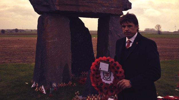 Chris Coleman laying a wreath